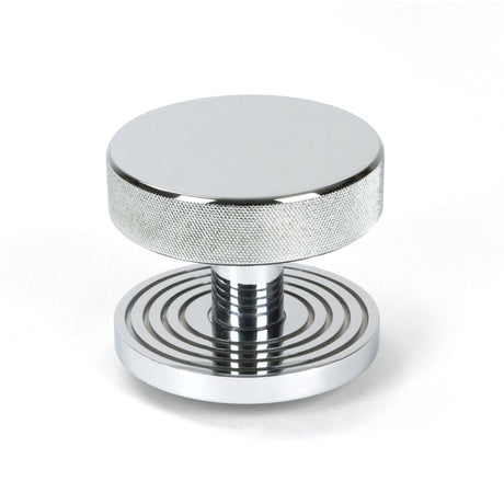 This is an image showing From The Anvil - Polished Chrome Brompton Centre Door Knob (Beehive) available from trade door handles, quick delivery and discounted prices