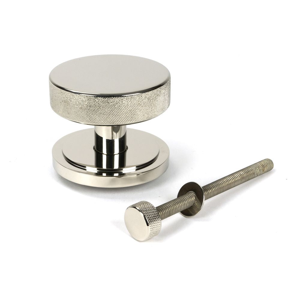 This is an image showing From The Anvil - Polished Nickel Brompton Centre Door Knob (Art Deco) available from trade door handles, quick delivery and discounted prices