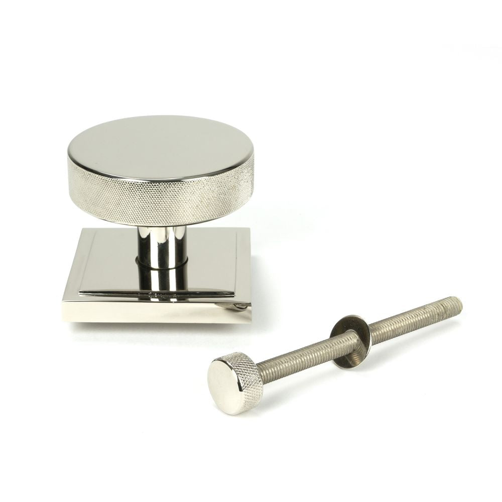 This is an image showing From The Anvil - Polished Nickel Brompton Centre Door Knob (Square) available from trade door handles, quick delivery and discounted prices