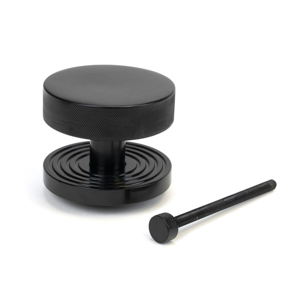 This is an image showing From The Anvil - Black Brompton Centre Door Knob (Beehive) available from trade door handles, quick delivery and discounted prices