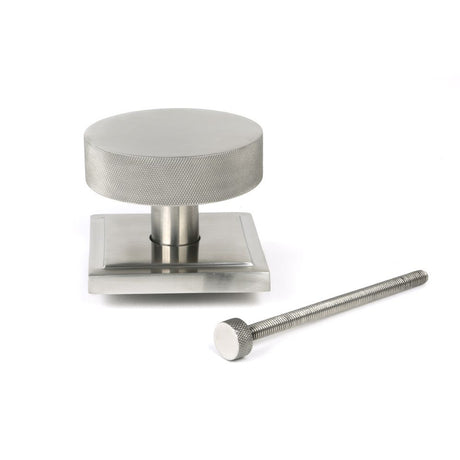 This is an image showing From The Anvil - Satin Marine SS (316) Brompton Centre Door Knob (Square) available from trade door handles, quick delivery and discounted prices