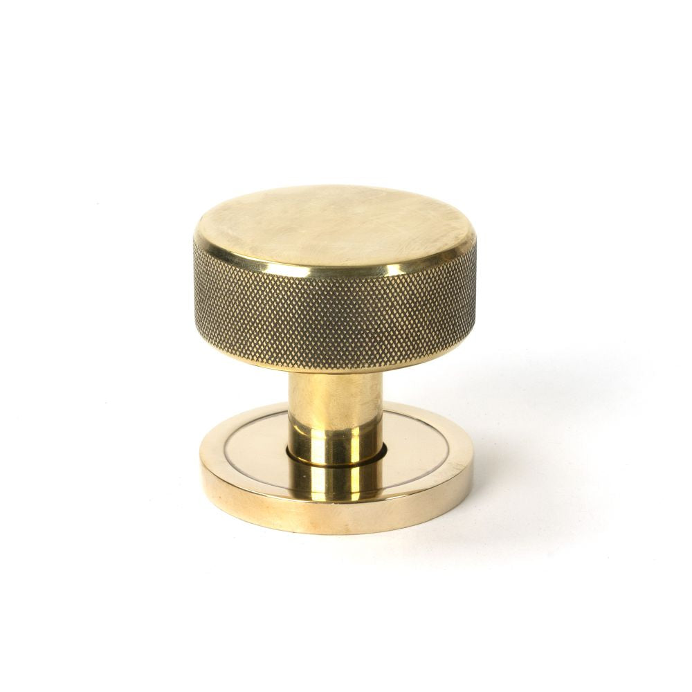 This is an image showing From The Anvil - Aged Brass Brompton Mortice/Rim Knob Set (Plain) available from trade door handles, quick delivery and discounted prices