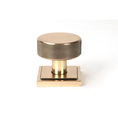 This is an image showing From The Anvil - Polished Bronze Brompton Mortice/Rim Knob Set (Square) available from trade door handles, quick delivery and discounted prices