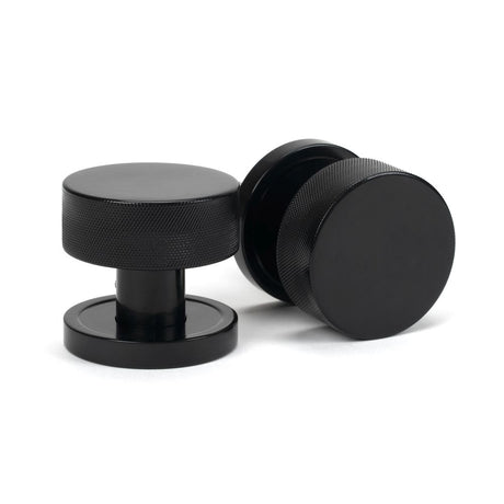 This is an image showing From The Anvil - Black Brompton Mortice/Rim Knob Set (Plain) available from trade door handles, quick delivery and discounted prices