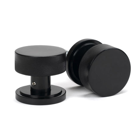 This is an image showing From The Anvil - Black Brompton Mortice/Rim Knob Set (Art Deco) available from trade door handles, quick delivery and discounted prices