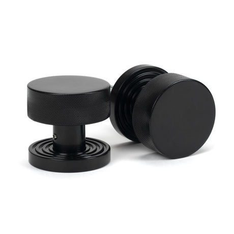 This is an image showing From The Anvil - Black Brompton Mortice/Rim Knob Set (Beehive) available from trade door handles, quick delivery and discounted prices