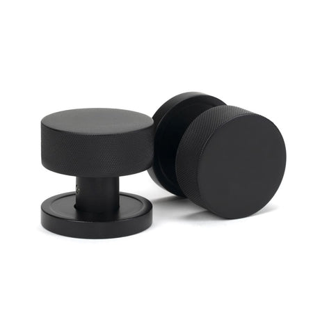 This is an image showing From The Anvil - Matt Black Brompton Mortice/Rim Knob Set (Plain) available from trade door handles, quick delivery and discounted prices