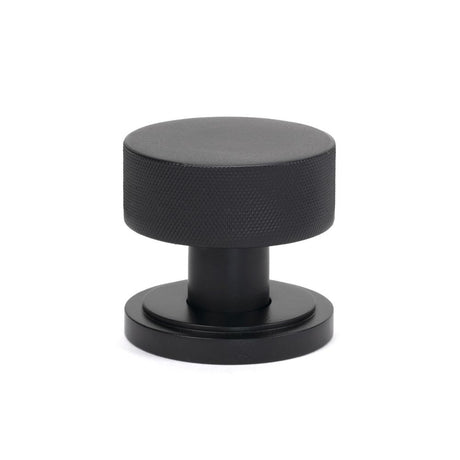 This is an image showing From The Anvil - Matt Black Brompton Mortice/Rim Knob Set (Art Deco) available from trade door handles, quick delivery and discounted prices