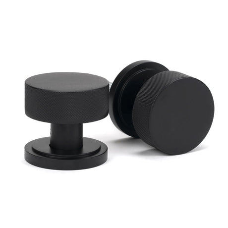This is an image showing From The Anvil - Matt Black Brompton Mortice/Rim Knob Set (Art Deco) available from trade door handles, quick delivery and discounted prices