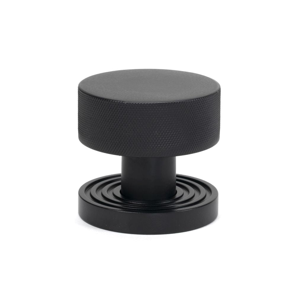 This is an image showing From The Anvil - Matt Black Brompton Mortice/Rim Knob Set (Beehive) available from trade door handles, quick delivery and discounted prices