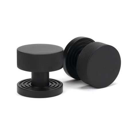 This is an image showing From The Anvil - Matt Black Brompton Mortice/Rim Knob Set (Beehive) available from trade door handles, quick delivery and discounted prices