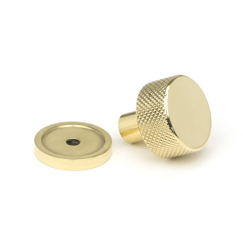 This is an image showing From The Anvil - Polished Brass Brompton Cabinet Knob - 25mm (Plain) available from trade door handles, quick delivery and discounted prices