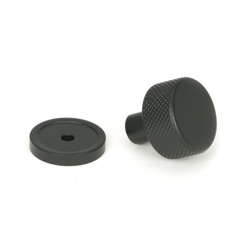 This is an image showing From The Anvil - Matt Black Brompton Cabinet Knob - 25mm (Plain) available from trade door handles, quick delivery and discounted prices