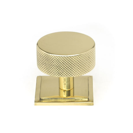 This is an image showing From The Anvil - Polished Brass Brompton Cabinet Knob - 38mm (Square) available from trade door handles, quick delivery and discounted prices