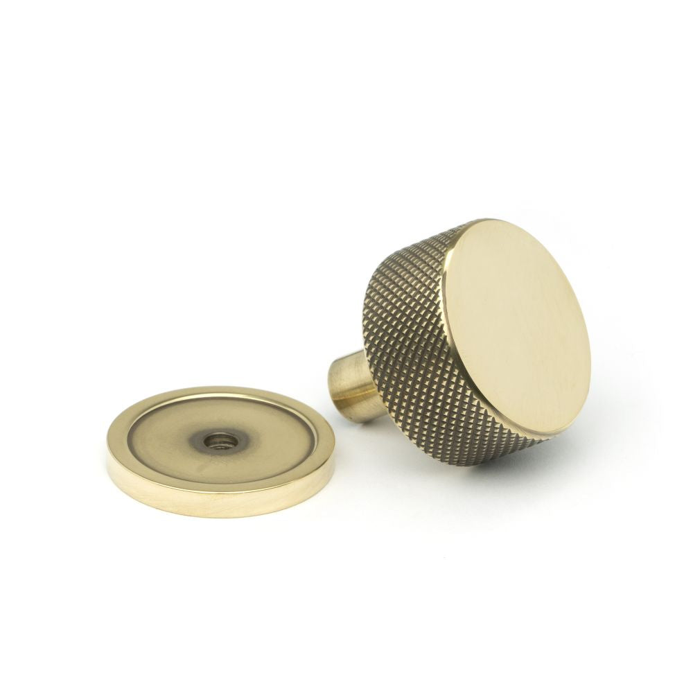 This is an image showing From The Anvil - Aged Brass Brompton Cabinet Knob - 32mm (Plain) available from trade door handles, quick delivery and discounted prices