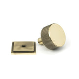 This is an image showing From The Anvil - Aged Brass Brompton Cabinet Knob - 32mm (Square) available from trade door handles, quick delivery and discounted prices