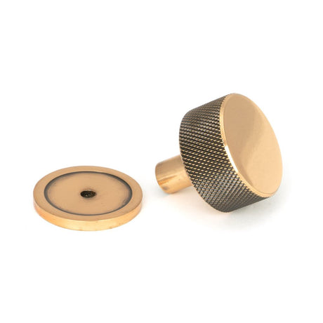 This is an image showing From The Anvil - Polished Bronze Brompton Cabinet Knob - 32mm (Plain) available from trade door handles, quick delivery and discounted prices