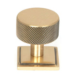 This is an image showing From The Anvil - Polished Bronze Brompton Cabinet Knob - 32mm (Square) available from trade door handles, quick delivery and discounted prices