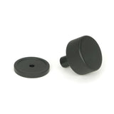 This is an image showing From The Anvil - Matt Black Brompton Cabinet Knob - 32mm (Plain) available from trade door handles, quick delivery and discounted prices