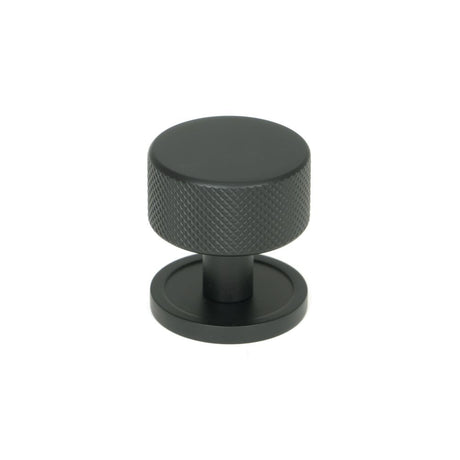 This is an image showing From The Anvil - Matt Black Brompton Cabinet Knob - 32mm (Plain) available from trade door handles, quick delivery and discounted prices