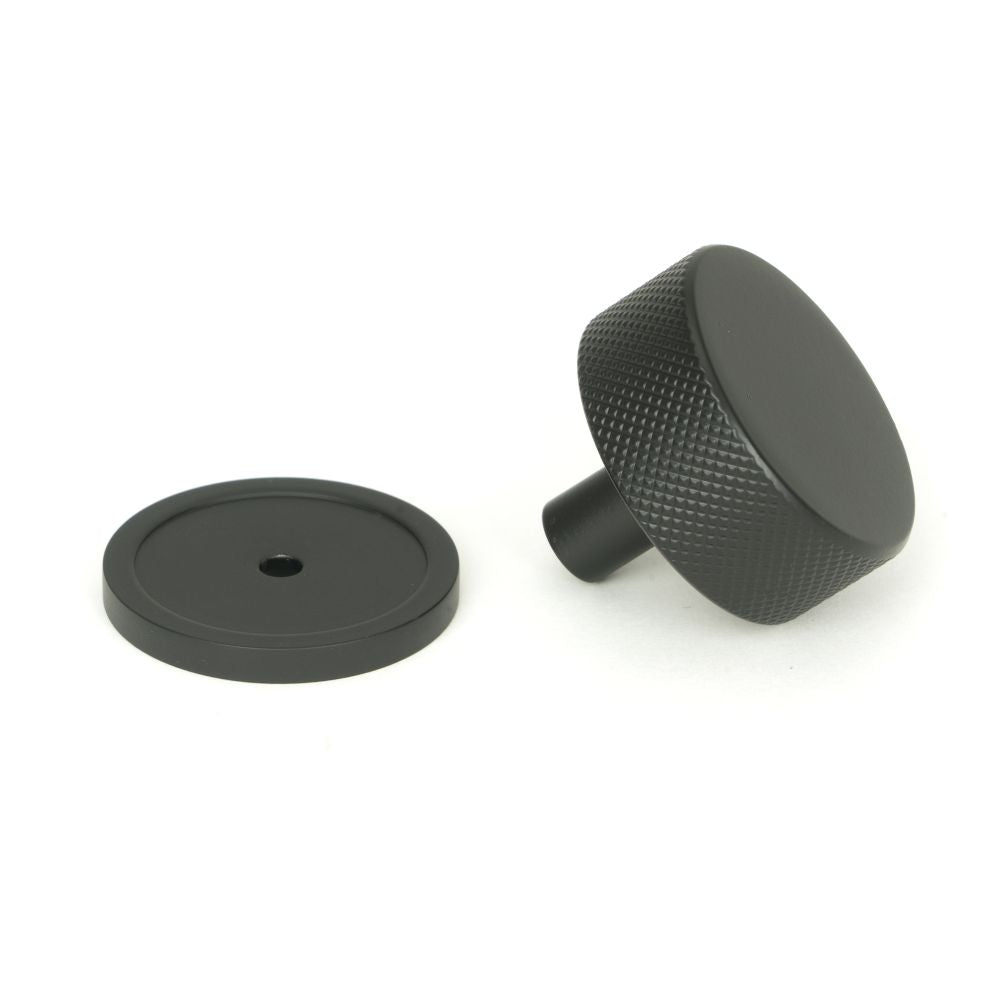 This is an image showing From The Anvil - Matt Black Brompton Cabinet Knob - 38mm (Plain) available from trade door handles, quick delivery and discounted prices