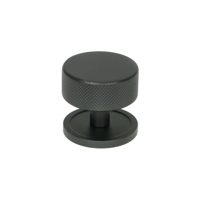 This is an image showing From The Anvil - Matt Black Brompton Cabinet Knob - 38mm (Plain) available from trade door handles, quick delivery and discounted prices