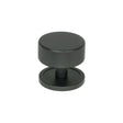 This is an image showing From The Anvil - Matt Black Brompton Cabinet Knob - 38mm (Plain) available from trade door handles, quick delivery and discounted prices