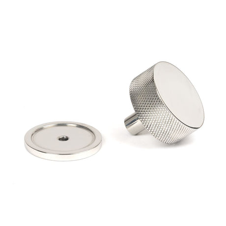 This is an image showing From The Anvil - Polished SS (304) Brompton Cabinet Knob - 38mm (Plain) available from trade door handles, quick delivery and discounted prices