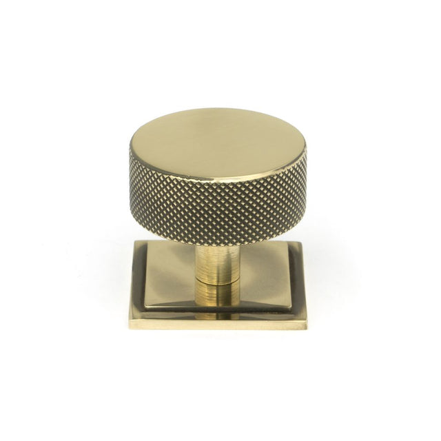 This is an image showing From The Anvil - Aged Brass Brompton Cabinet Knob - 38mm (Square) available from trade door handles, quick delivery and discounted prices