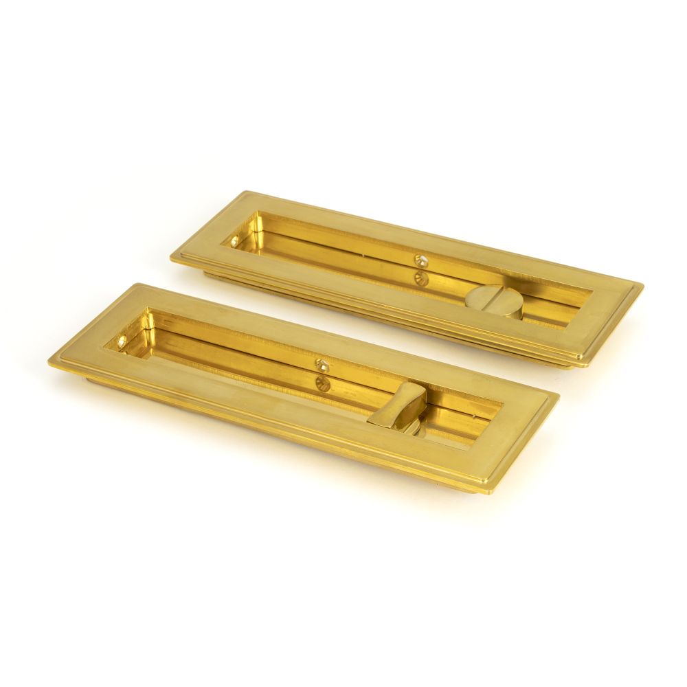 This is an image showing From The Anvil - Polished Brass 175mm Art Deco Rectangular Pull - Privacy Set available from trade door handles, quick delivery and discounted prices