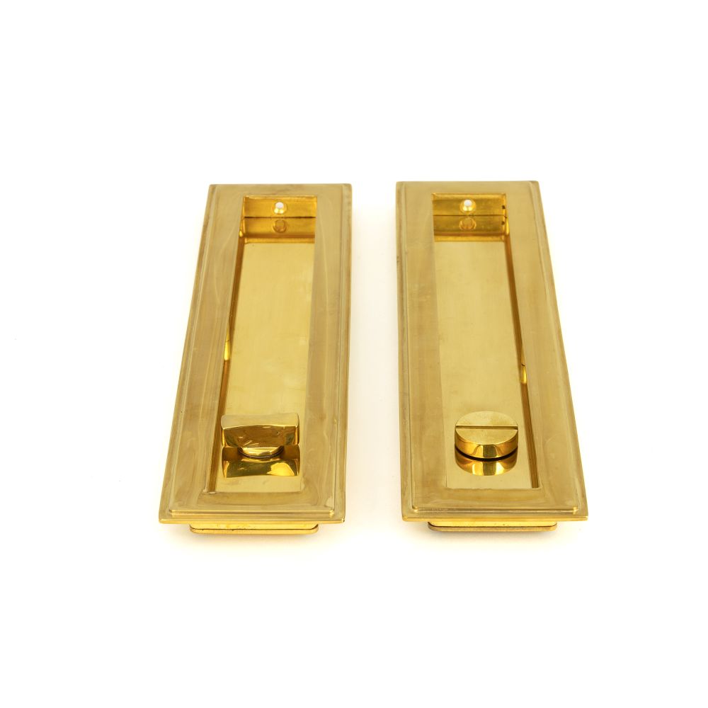 This is an image showing From The Anvil - Polished Brass 250mm Art Deco Rectangular Pull - Privacy Set available from trade door handles, quick delivery and discounted prices