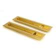 This is an image showing From The Anvil - Polished Brass 250mm Art Deco Rectangular Pull - Privacy Set available from trade door handles, quick delivery and discounted prices