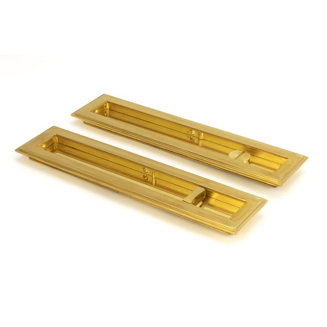 This is an image showing From The Anvil - Polished Brass 250mm Art Deco Rectangular Pull - Privacy Set available from trade door handles, quick delivery and discounted prices