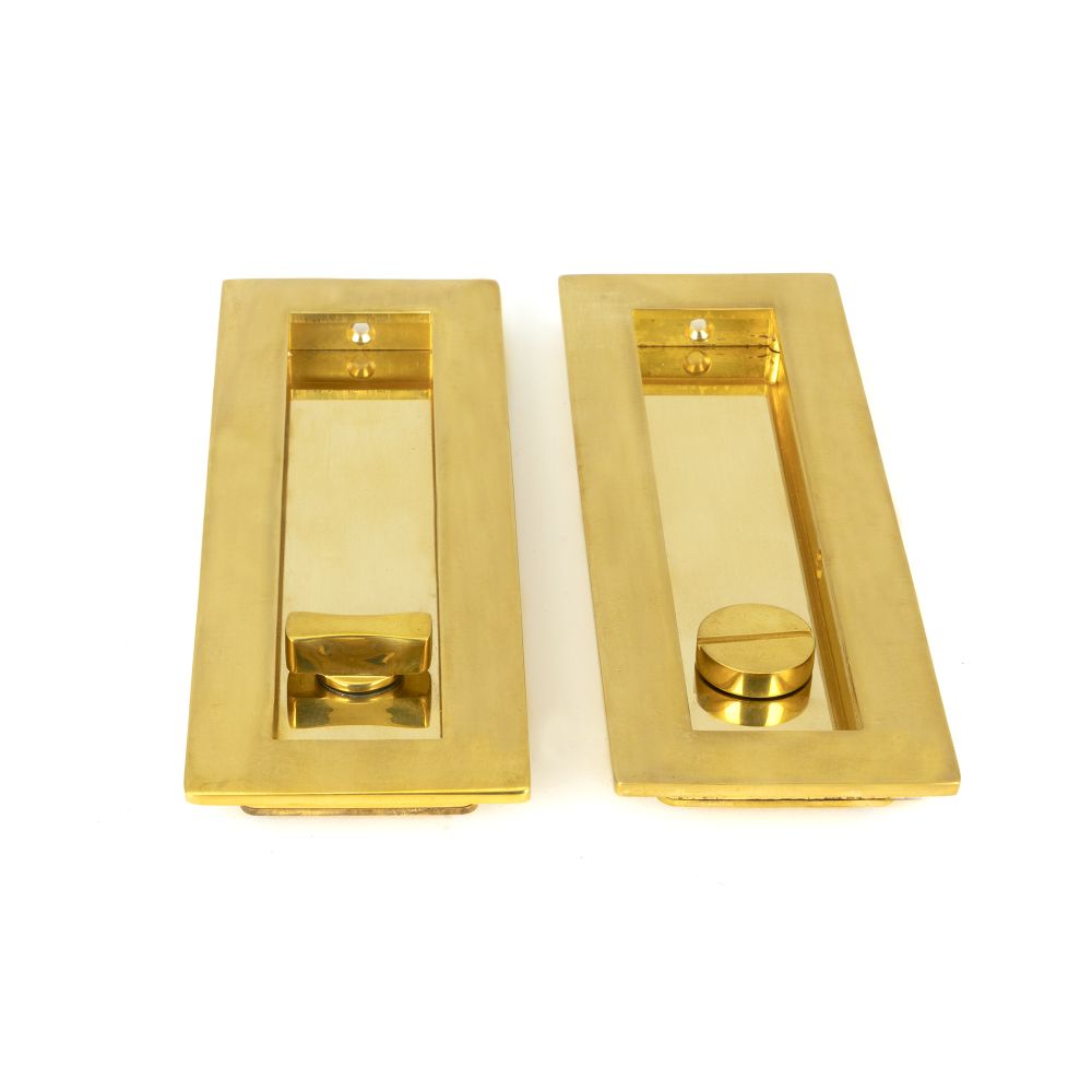 This is an image showing From The Anvil - Polished Brass 175mm Plain Rectangular Pull - Privacy Set available from trade door handles, quick delivery and discounted prices