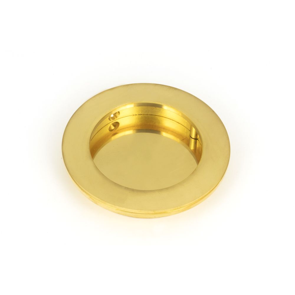 This is an image showing From The Anvil - Polished Brass 75mm Plain Round Pull available from trade door handles, quick delivery and discounted prices