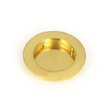 This is an image showing From The Anvil - Polished Brass 75mm Plain Round Pull available from trade door handles, quick delivery and discounted prices