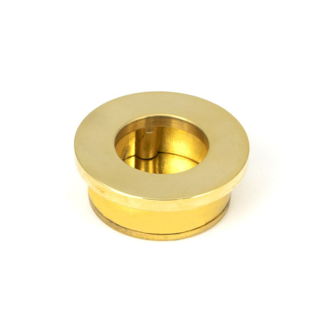 This is an image showing From The Anvil - Polished Brass 34mm Round Finger Edge Pull available from trade door handles, quick delivery and discounted prices