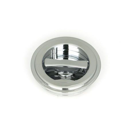 This is an image showing From The Anvil - Polished Chrome 60mm Art Deco Round Pull - Privacy Set available from trade door handles, quick delivery and discounted prices