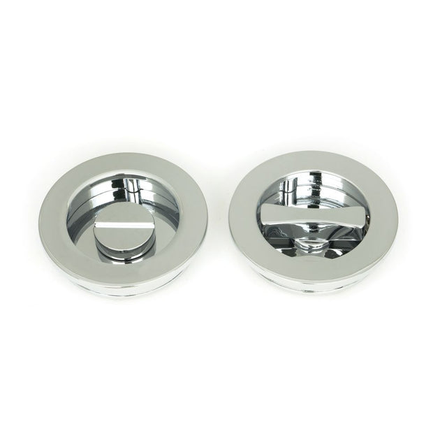 This is an image showing From The Anvil - Polished Chrome 60mm Plain Round Pull - Privacy Set available from trade door handles, quick delivery and discounted prices