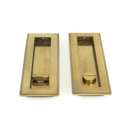 This is an image showing From The Anvil - Aged Brass 175mm Art Deco Rectangular Pull - Privacy Set available from trade door handles, quick delivery and discounted prices