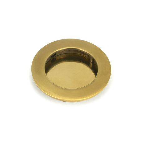 This is an image showing From The Anvil - Aged Brass 75mm Plain Round Pull available from trade door handles, quick delivery and discounted prices