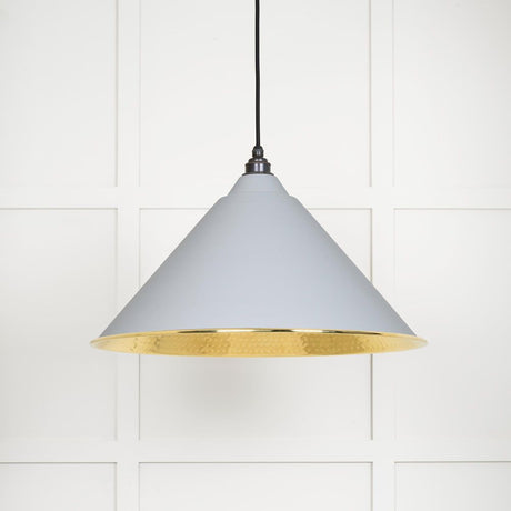 This is an image showing From The Anvil - Hammered Brass Hockley Pendant in Birch available from trade door handles, quick delivery and discounted prices