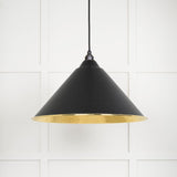 This is an image showing From The Anvil - Hammered Brass Hockley Pendant in Elan Black available from trade door handles, quick delivery and discounted prices