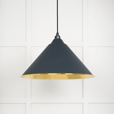 This is an image showing From The Anvil - Hammered Brass Hockley Pendant in Soot available from trade door handles, quick delivery and discounted prices