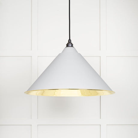 This is an image showing From The Anvil - Smooth Brass Hockley Pendant in Flock available from trade door handles, quick delivery and discounted prices