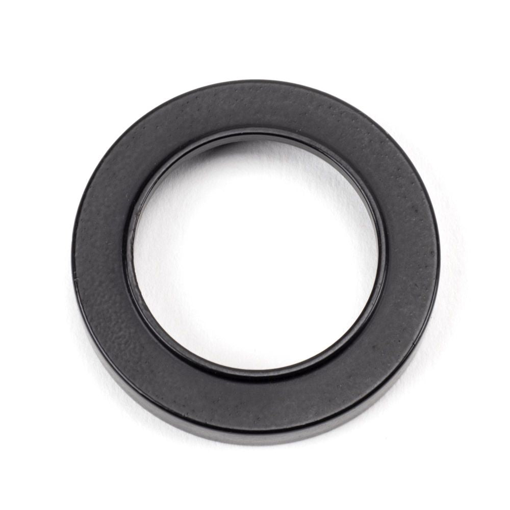 This is an image showing From The Anvil - Matt Black Round Escutcheon (Plain) available from trade door handles, quick delivery and discounted prices