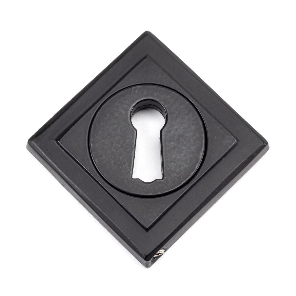 This is an image showing From The Anvil - Matt Black Round Escutcheon (Square) available from trade door handles, quick delivery and discounted prices