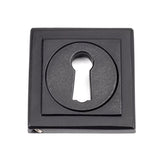 This is an image showing From The Anvil - Matt Black Round Escutcheon (Square) available from trade door handles, quick delivery and discounted prices