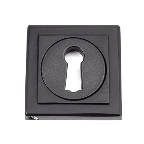 This is an image showing From The Anvil - Matt Black Round Escutcheon (Square) available from trade door handles, quick delivery and discounted prices