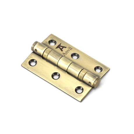 This is an image showing From The Anvil - Aged Brass 3" Ball Bearing Butt Hinge (pair) ss available from trade door handles, quick delivery and discounted prices